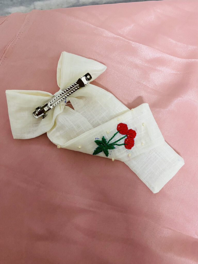 Cherry Whimsy Garden Bloom: Hand-Embroidered Pearl-Kissed Linen Bow Clip